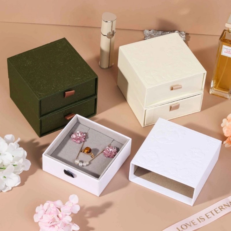 Drawer style jewelry box closed with embossing – rigid cardboard construction for light luxury packaging