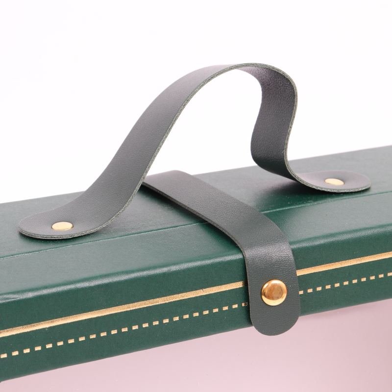 Green Christmas gift box opened – flip top PVC window revealing gift inside