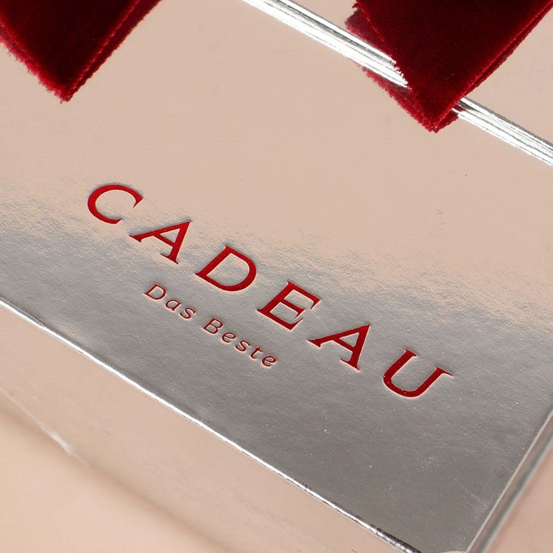 Hot stamping logo example – gold foil on silver surface for premium brand identity