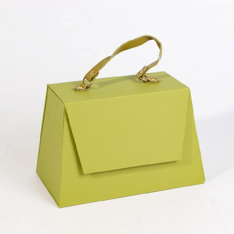 Leather handle with metal snap button on trapezoidal gift box – portable aesthetically pleasing and practical