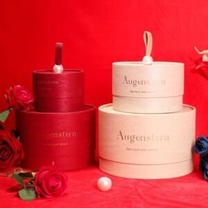 Round gift box opened – pearl handle lifting lid, interior for lipstick and candles