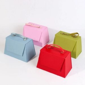 Trapezoidal foldable gift box closed with leather handle – one piece design for economical shipping