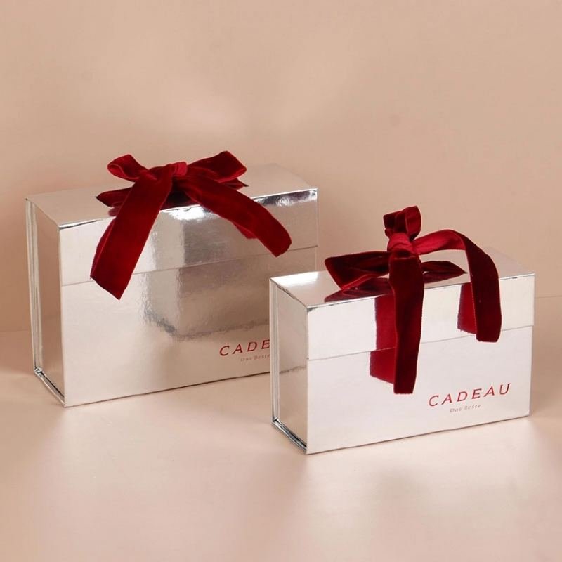 Velvet ribbon closeup – warm, plush texture contrasting cool silver for quiet luxury